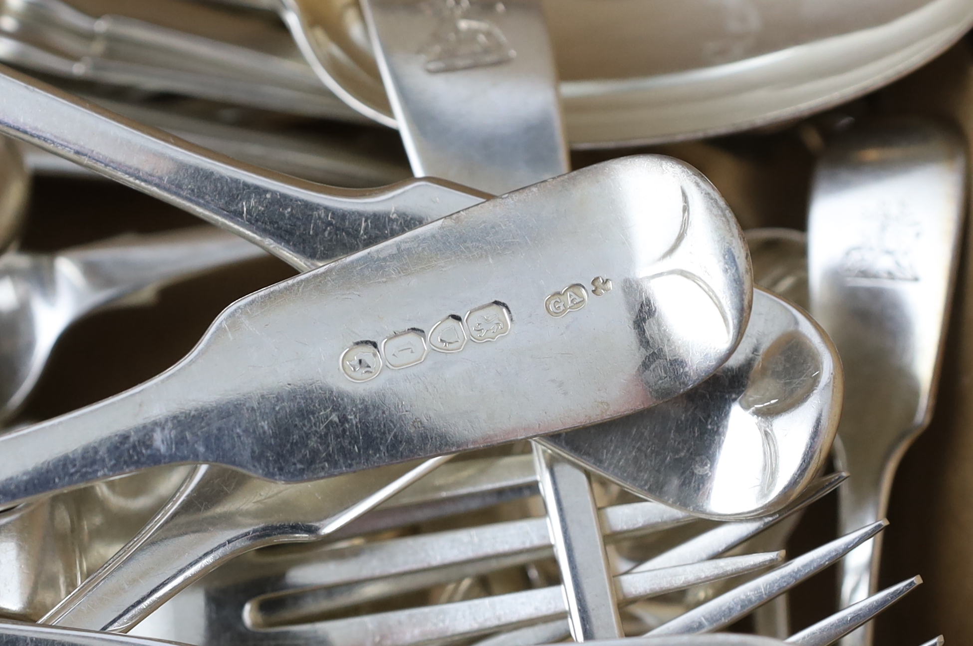 A part canteen of Victorian silver fiddle pattern flatware, by George Adams